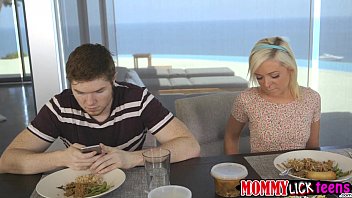 MILF Nina licks Cleos tight shaved pussy under the table