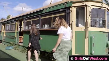 Curvy busty babes lick each other in abandoned tram